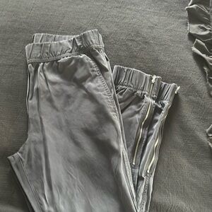 Gap silk joggers with side zippers at the bottom of the leg
